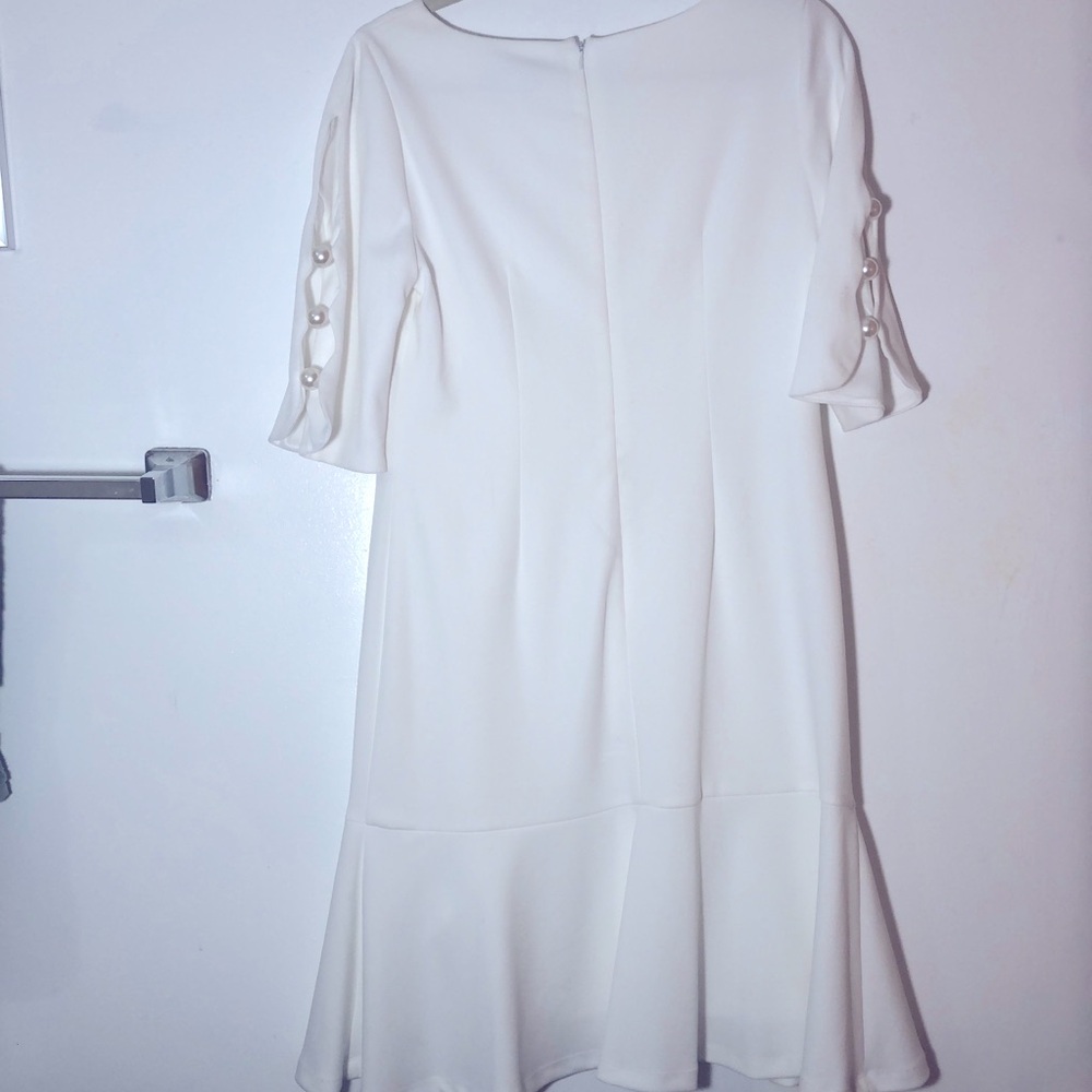 Dress, white with bottom ruffle and pearls sleeves size 10 made by Shelby Palmer